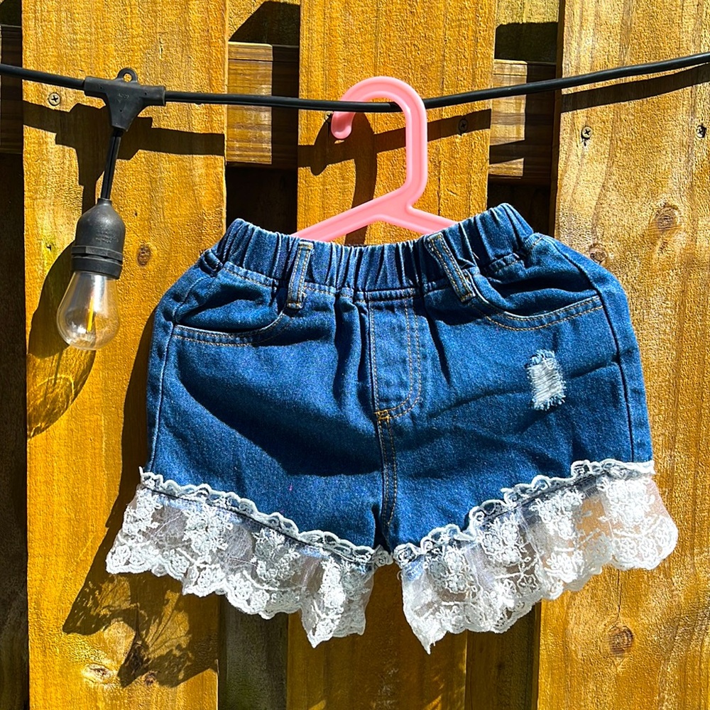 Demin girl shorts with lace. Has some tiny pink spots. See pictures.
